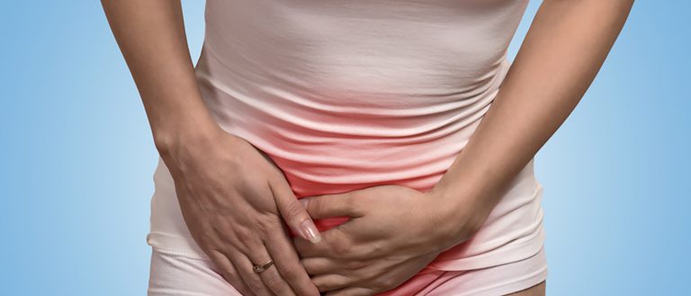 cropped image woman holding her crotch lower abdomen with hands