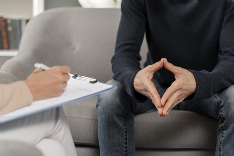 man-talking-to-therapist-scaled