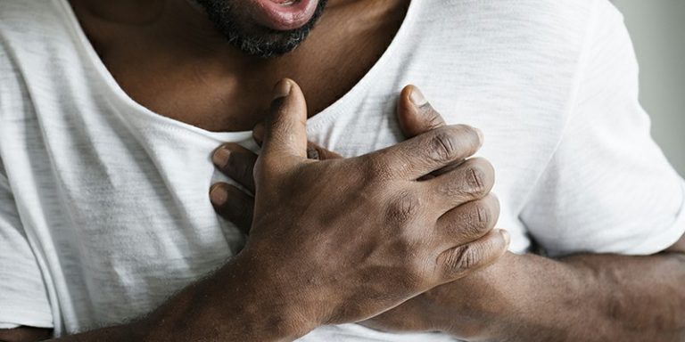 Black man having a heart attack